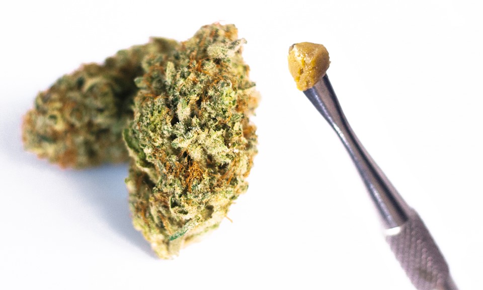 cannabis flower next to cannabis dab zoomed